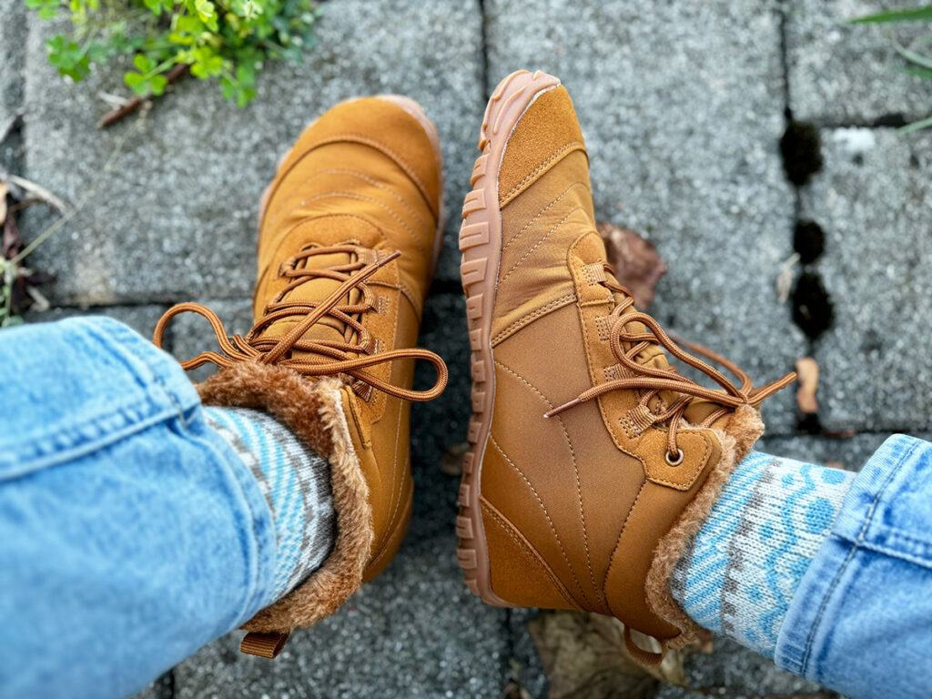 Brown insulated barefoot boots with warm inner lining.