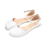 White Mary Jane ballet flats with ankle strap, studio background