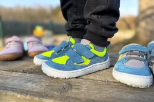 Bright kids’ barefoot sneakers with Velcro straps, outdoor setting