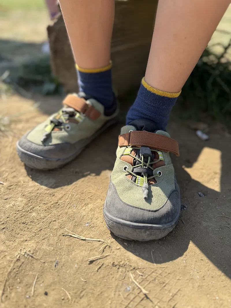 Kids barefoot hiking shoes worn outdoors